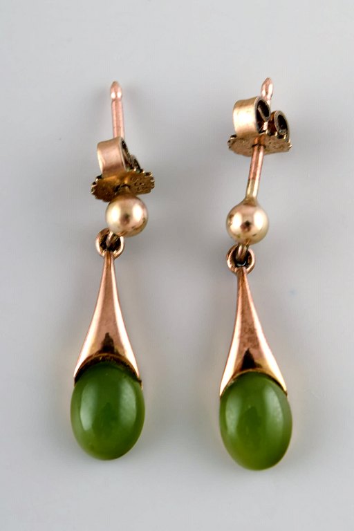 Danish 8K gold ear studs with green stones. Mid-1900s.