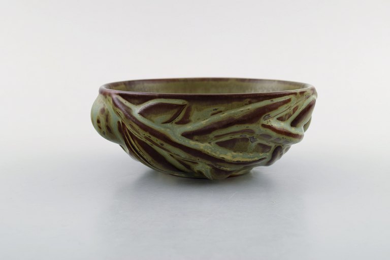 Axel Salto for Royal Copenhagen: Stoneware bowl modeled in organic shape, decorated with glaze in earth tones.  1940