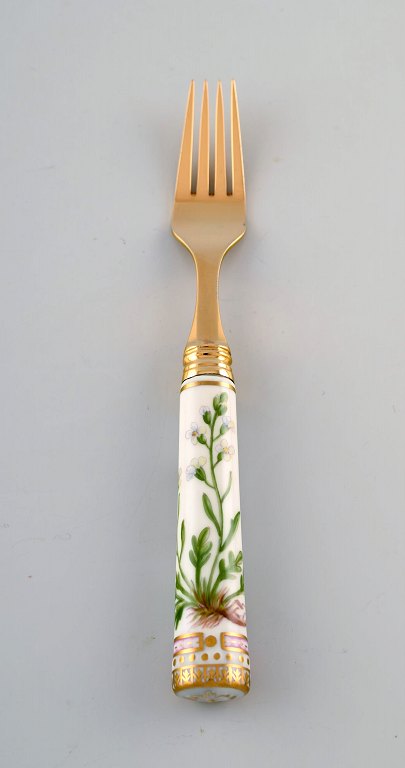 Michelsen for Royal Copenhagen. "Flora Danica" lunch fork made of gold plated sterling silver. Porcelain handles decorated in colors and gold with flowers.
