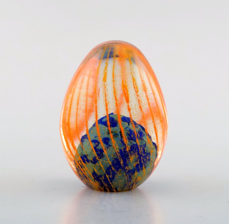 Monica Backström for Kosta Boda, Sweden. Eggs in clear mouth blown art glass decorated with orange stripes.