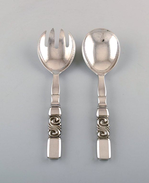 Georg Jensen. Cutlery, Scroll No. 22, hammered sterling silver salad set in full silver.