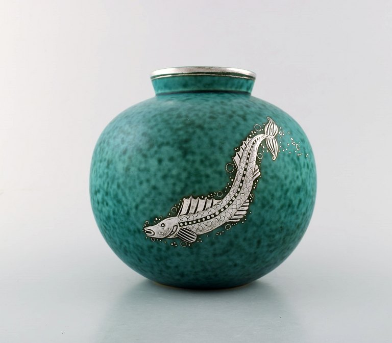 Wilhelm Kåge, Gustavsberg, Round hand crafted art deco vase in ceramic decorated with fish in silver inlaid.