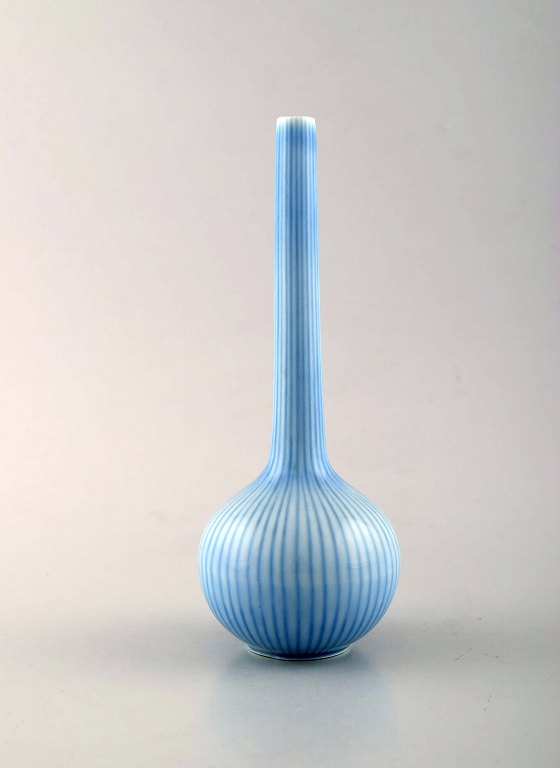 Gunnar Nylund for Rørstrand. Rare narrow necked porcelain vase in blue shades. 1950