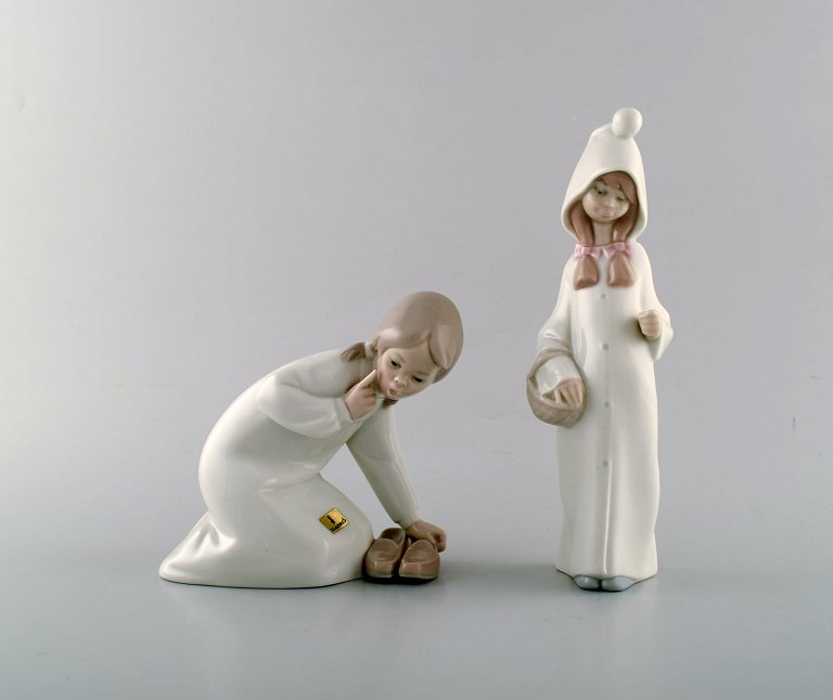Lladro, Spain. Two child figures in glazed porcelain. 20th century.