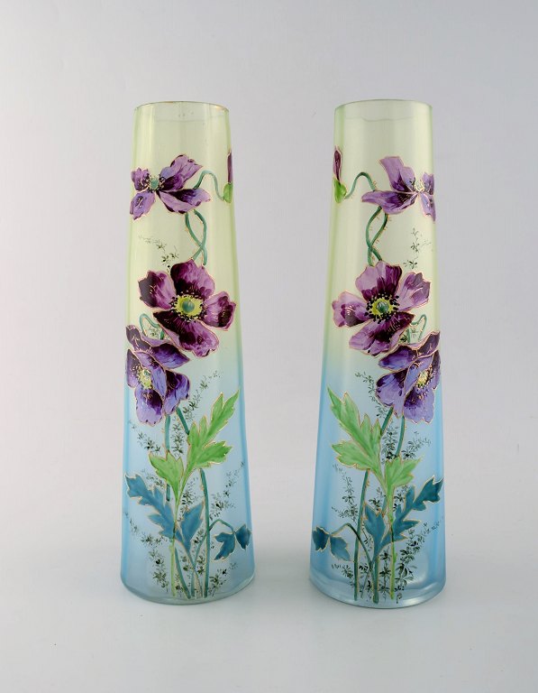 A couple of Legras vases with hand painted enamel decoration. Purple flowers with gold border on green blue background. 1890