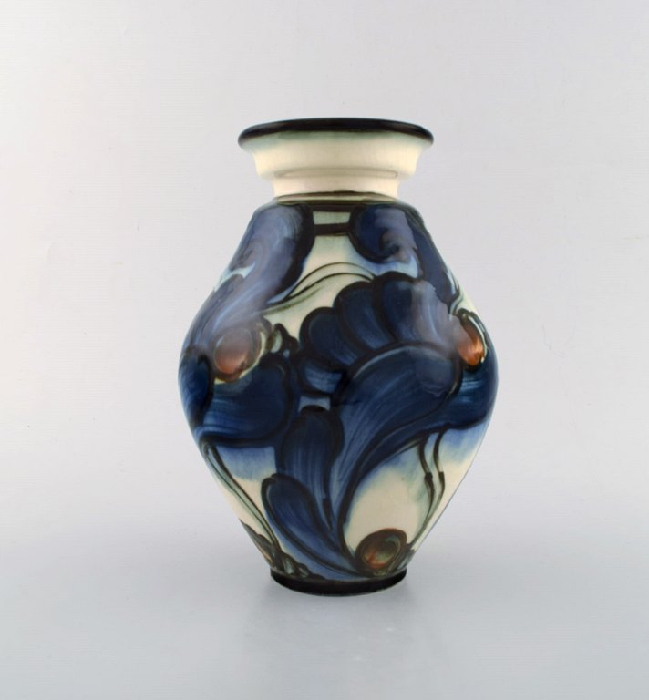 Danico, Denmark. Large glazed stoneware vase in modern design. Blue flowers on light background. 1920