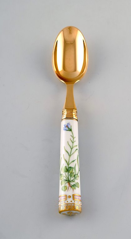 Georg Jensen for Royal Copenhagen. "Flora Danica" dinner spoon of gold plated sterling silver. Porcelain handle decorated in colors and gold with flowers.
