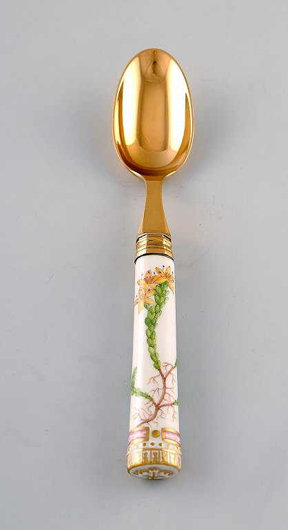 Georg Jensen for Royal Copenhagen. "Flora Danica" dinner spoon of gold plated sterling silver. Porcelain handle decorated in colors and gold with flowers.