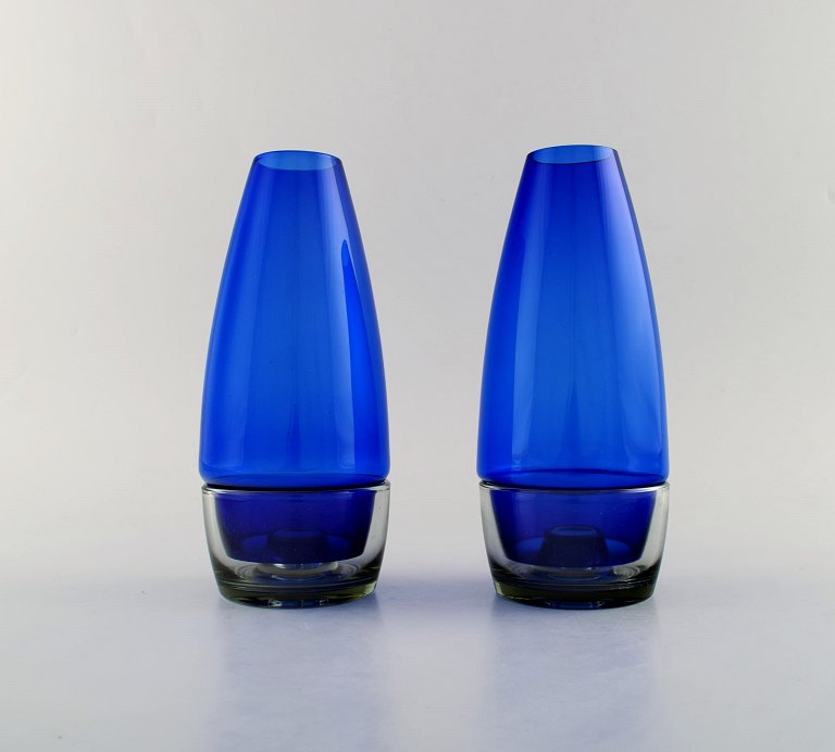 Per Lütken for Holmegaard. A pair of rare "Hygge" lamps for candles in clear and blue art glass. Designed in 1958.