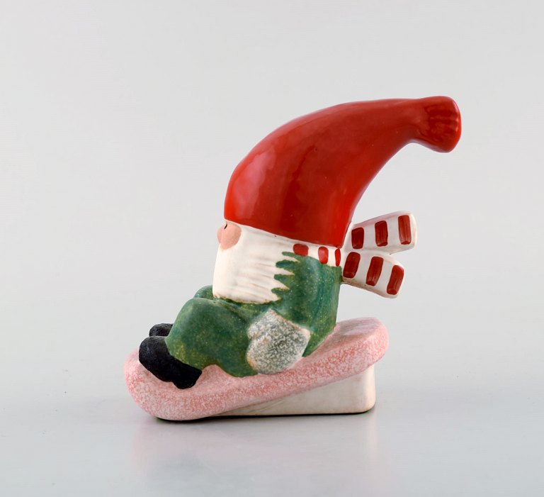 Lisa Larson for Gustavsberg. Candleholder. Elf on a sledge in glazed stoneware. Late 20th century.