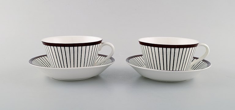 Stig Lindberg for Gustavsberg. A pair of "Spisa Ribb" teacups with saucers. 1950 / 60