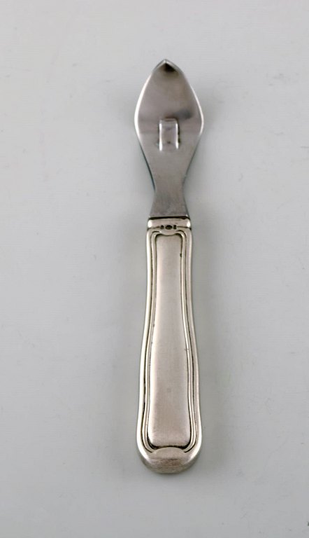 Rare Georg Jensen Old Danish can opener in sterling silver and stainless steel. 