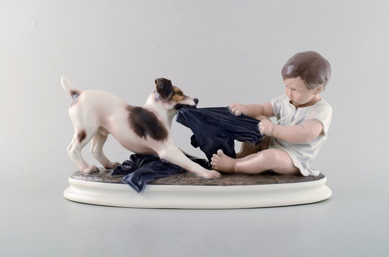 Large Dahl Jensen porcelain figurine. Boy and dog. Model number 1072. 2nd factory quality. 1930