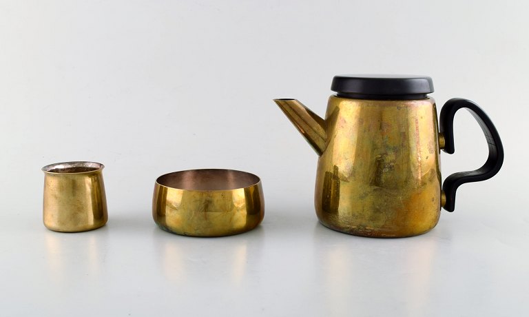 Henning Koppel (1918-81) for Georg Jensen, design 7002.Coffee pot and sugar / cream set in brass.