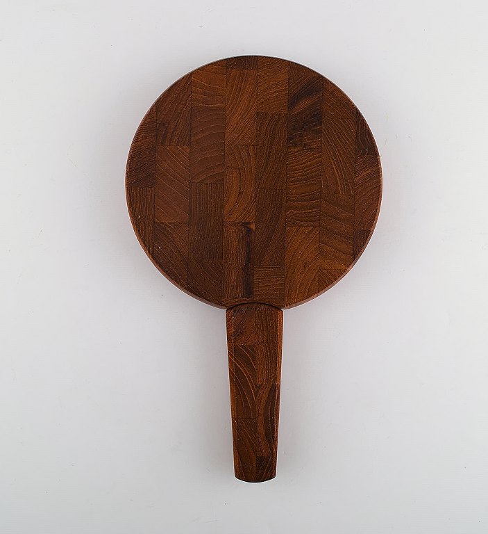 Jens Harald Quistgaard. Teak wood cutting board with built-in knife.Danish design, 1960s.