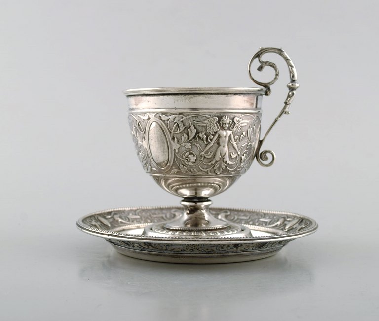 Gebrüder Friedländer, Berlin. Antique coffee cup with saucer in silver (800) with classicist motifs. 19th century.