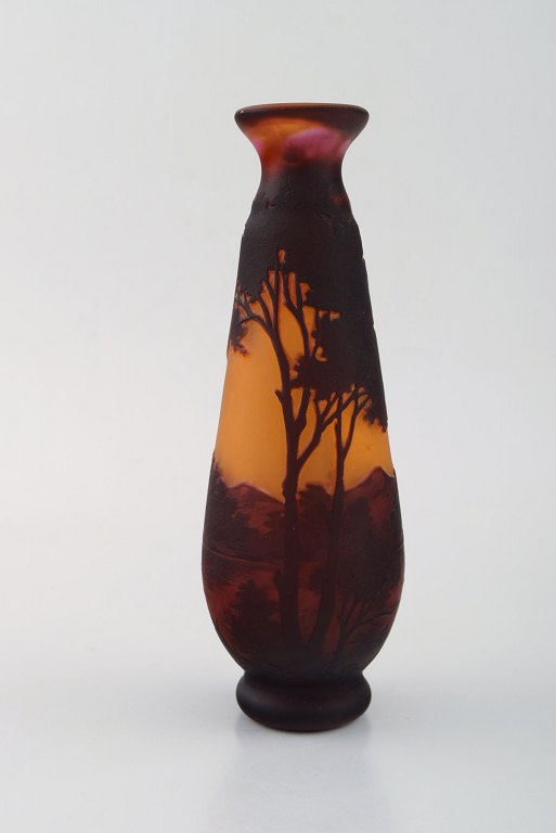 Emile Gallé, France. "Paysage" vase in mouth-blown art glass. Motif of landscape with sunset. Ca. 1900.