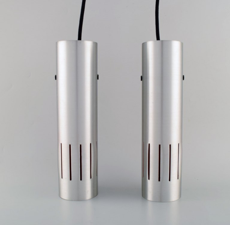 Jo Hammerborg for Fog and Mørup. Two Trombone ceiling lamps made of aluminum and orange lacquered metal. 1960