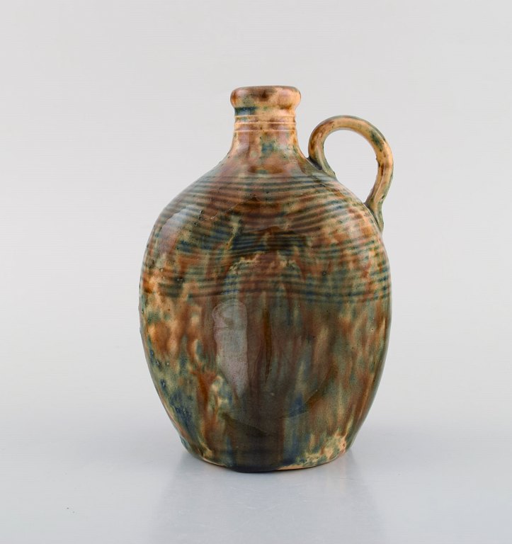 Gustaf Johnn for Höganäs. Antique art nouveau jug in glazed ceramic. Late 19th century.