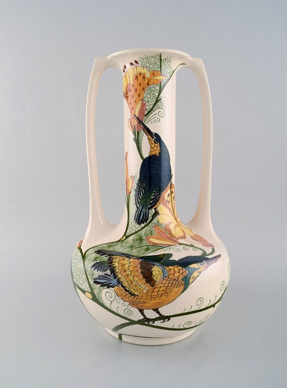 Amphora, Holland. Large art nouveau vase with handles in hand-painted faience with bird motifs. Early 20th century.