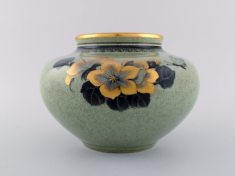 Royal Copenhagen vase in crackled porcelain with gold decoration and floral motifs. 1920