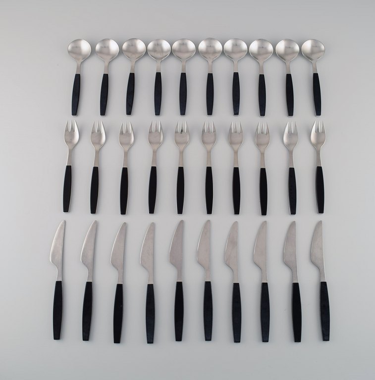 Henning Koppel for Georg Jensen. Strata service for ten people in stainless steel and black plastic. 1960s / 70