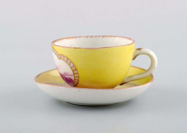 Antique and rare Meissen coffee cup with saucer in hand-painted porcelain with young boys. Purple on yellow background. Dated 1773-1814. Museum quality.