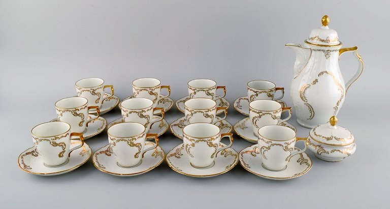 Rosenthal, Germany. Porcelain coffee service with gold decoration for 12 people with coffee pot and sugar bowl. 20th century.