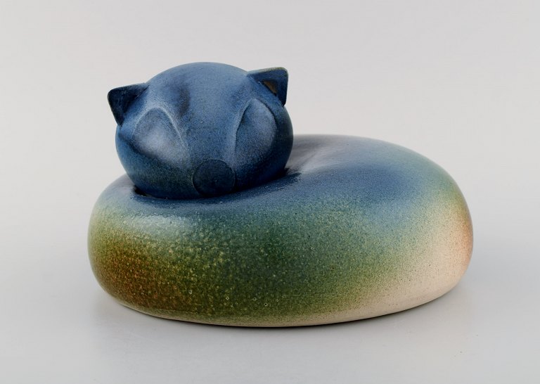 European studio ceramicist. Large unique figure of lying cat. Beautiful glaze in blue-green shades. 1980s.