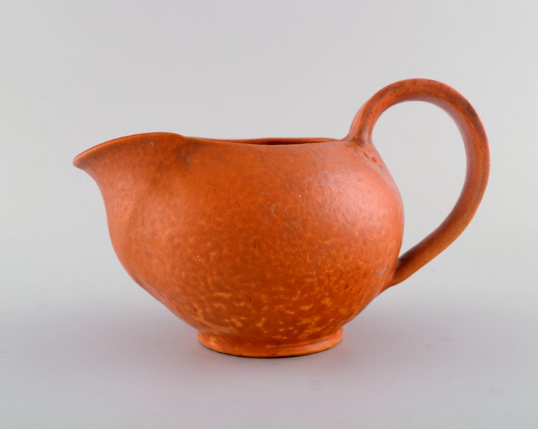 Svend Hammershøi (1873-1948) for Kähler. Jug in glazed ceramics. Beautiful orange uranium glaze. 1930 / 40s.