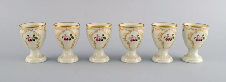 Six Rosenthal Classic Rose egg cups in hand-painted porcelain with flowers and gold decoration. Mid-20th century.