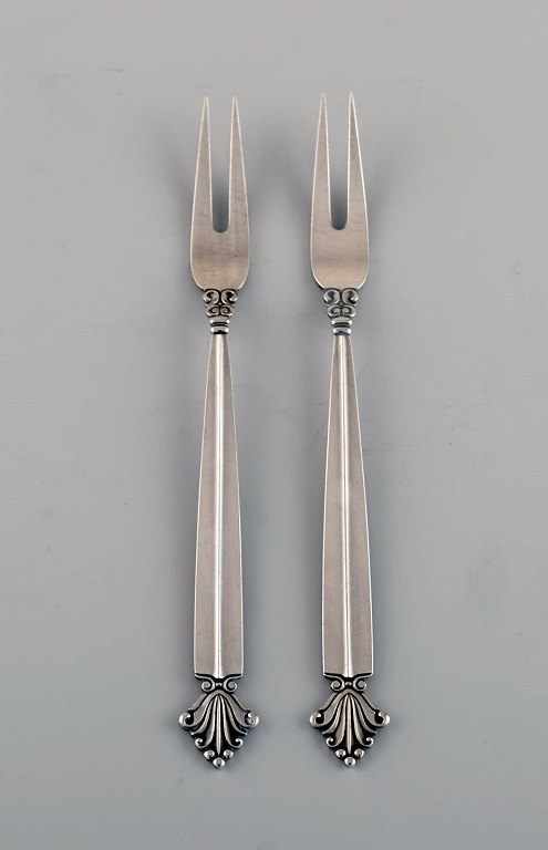 Two Georg Jensen Acanthus cold meat forks in sterling silver.