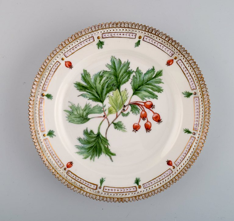 Royal Copenhagen Flora Danica plate in hand-painted porcelain with flowers and gold decoration. Dated 1949.