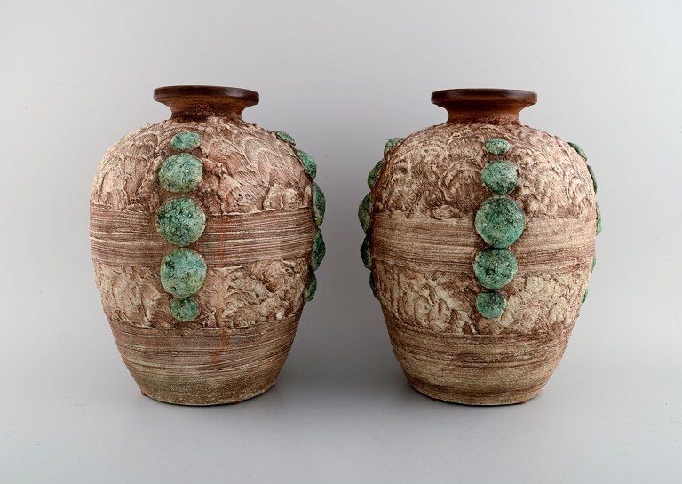 Louis Dage (1885-1961), French ceramist. Two large vases in glazed ceramics. Beautiful glaze in green and light earth tones. 1930s.