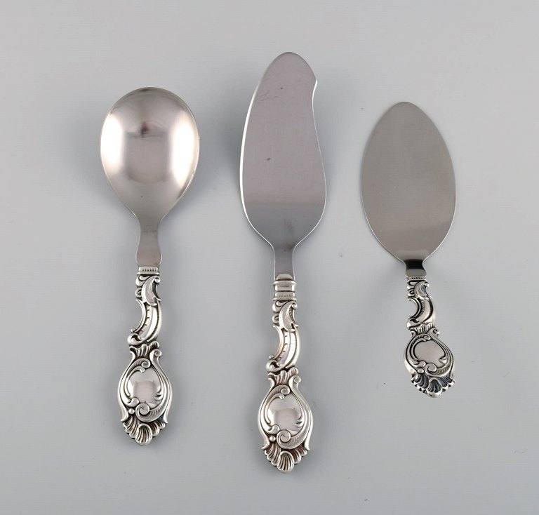 Danish silversmith. Three serving parts in silver (830). Rococo style, 1940s.