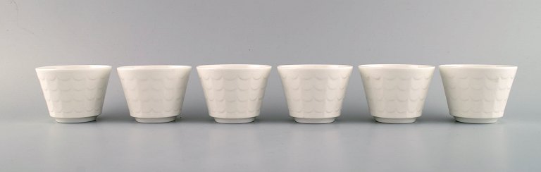 Wilhelm Kåge for Gustavsberg. Six flower pot covers in porcelain. Swedish design, 1960s.