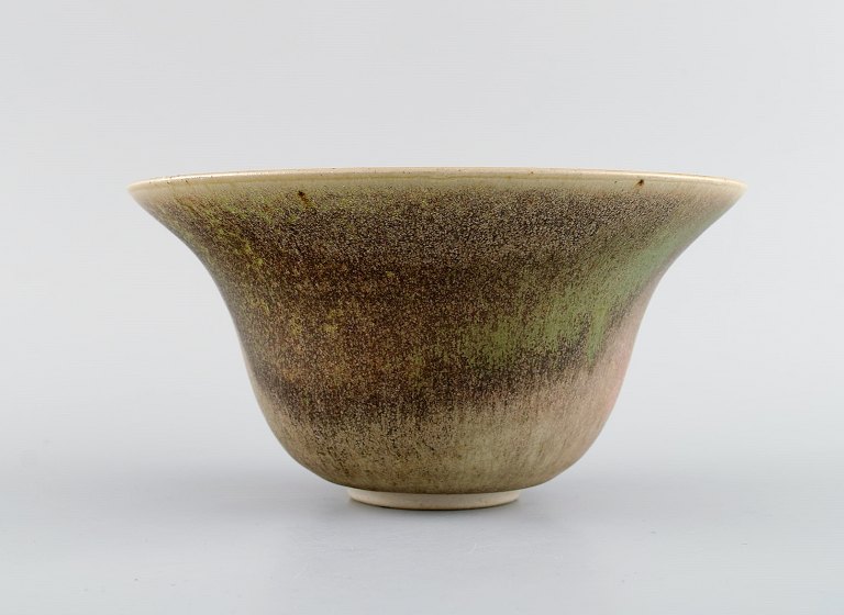 European studio ceramicist. Unique bowl in glazed stoneware. Beautiful glaze in green and light earth shades. Dated 1982.
