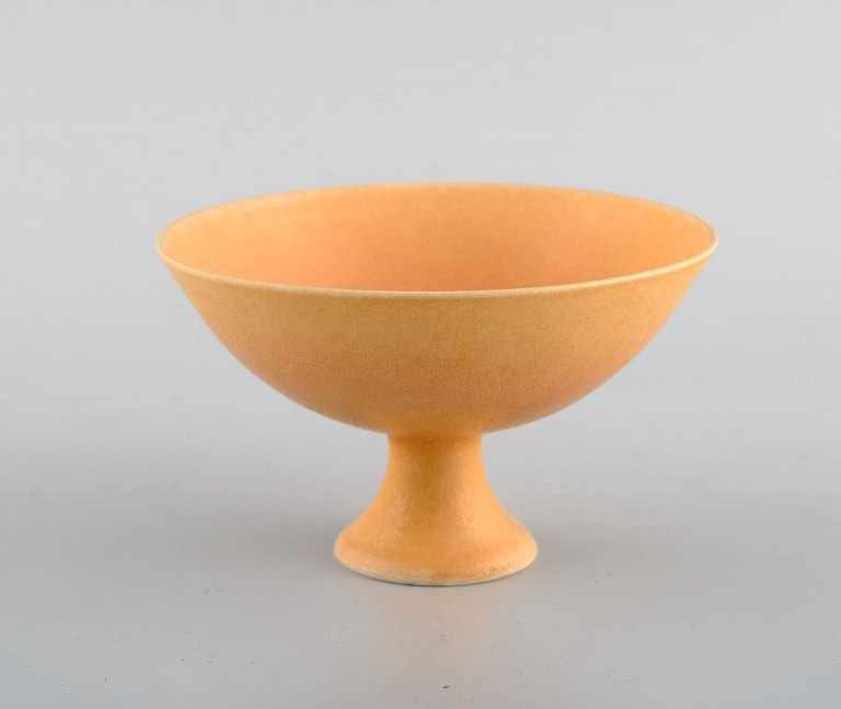 European studio ceramicist. Unique bowl on base in glazed ceramics. Beautiful glaze in light yellow shades. 21st Century.