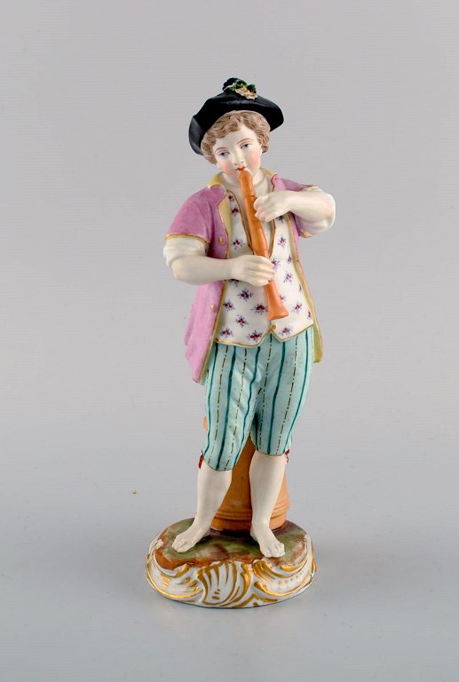 Antique Meissen figure in hand-painted porcelain. Boy playing flute. Marcolini period 1774-1814.