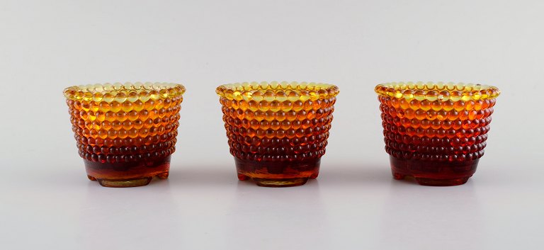Monica Bratt for Reijmyre. Three Pärlan candlesticks for small candles in mouth blown art glass. 1950s.