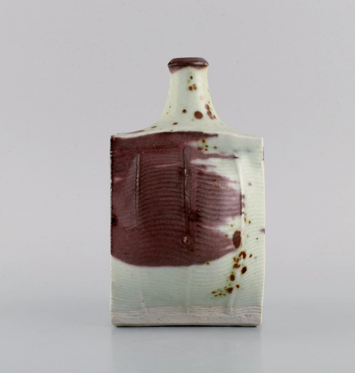 European studio ceramicist. Vase in glazed ceramics. Beautiful glaze in purple and pastel shades. Late 20th century.