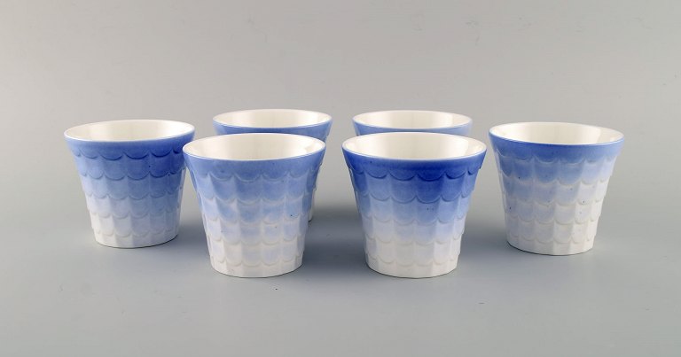 Wilhelm Kåge for Gustavsberg. Six flower pot covers in porcelain. Swedish design, 1960s.
