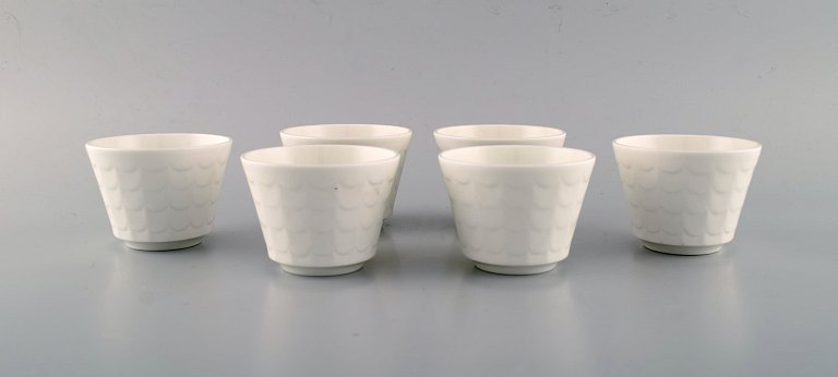 Wilhelm Kåge for Gustavsberg. Six flower pot covers in porcelain. Swedish design, 1960s.