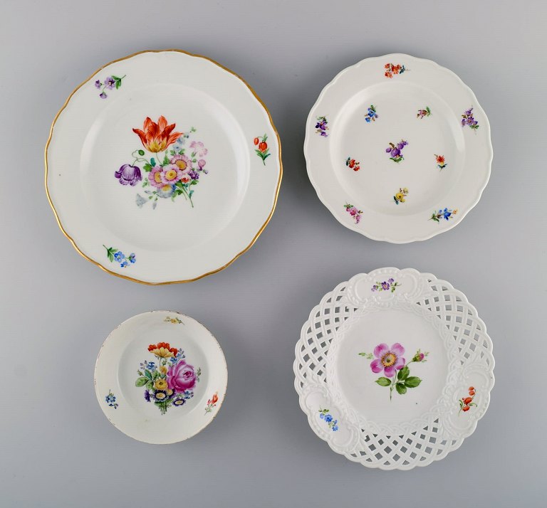 Antique Meissen bowl and three porcelain plates with hand-painted flowers. 19th century.