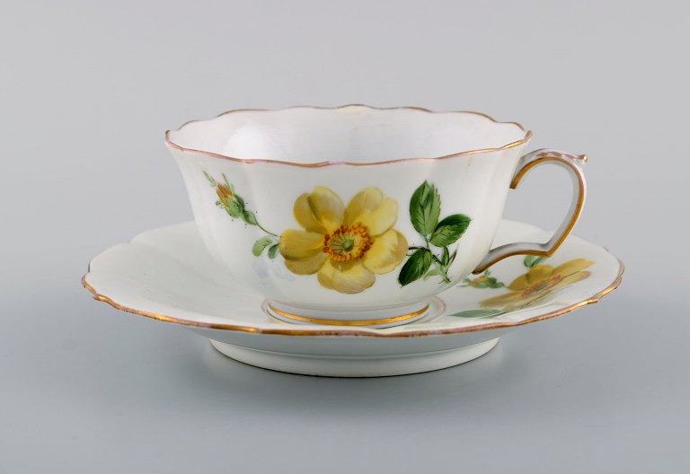 Antique Meissen teacup with saucer in hand-painted porcelain with floral motifs. Ca. 1900.