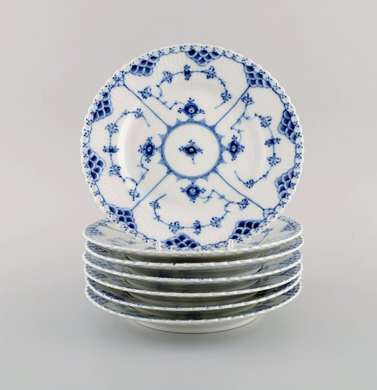 Seven Royal Copenhagen Blue Fluted Full Lace Plates. Model number 1/1087. 1960s.