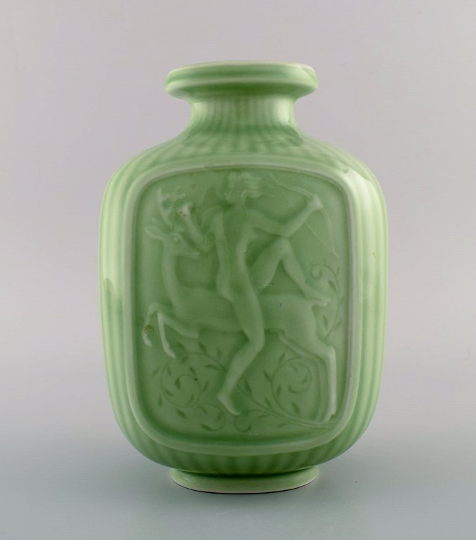 Gunnar Nylund and Harald Salomon for Rörstrand. Art deco vase in glazed ceramics with motifs of the hunting goddess Diana. Beautiful celadon glaze. 1940s.