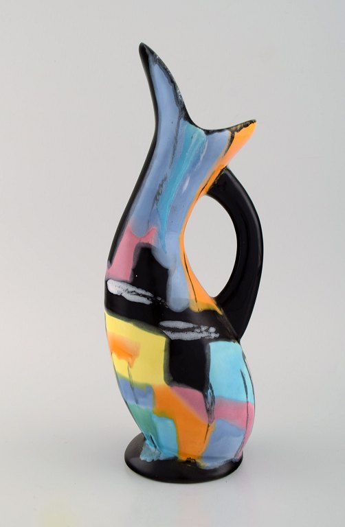 Longwy, France. Pigalle pitcher in hand-painted glazed ceramics. Abstract polychrome decoration. Mid-20th century.