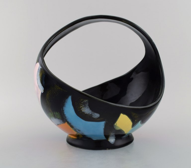 Longwy, France. Equinoxe basket in glazed ceramics. Abstract polychrome decoration on black background. Mid-20th century.