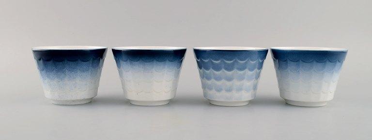Wilhelm Kåge for Gustavsberg. Four flower pot covers in porcelain. Swedish design, 1960s.